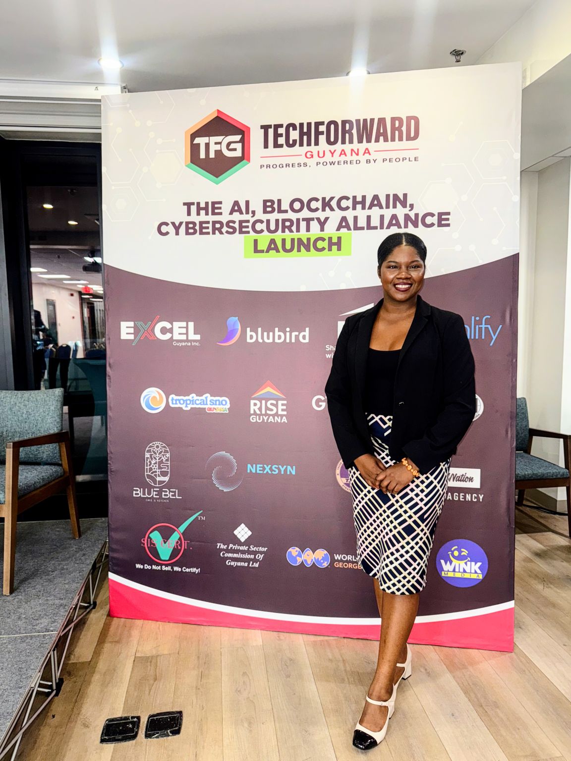 The AI, Blockchain and Cybersecurity Alliance launch banner at the World Trade Centre Guyana.
